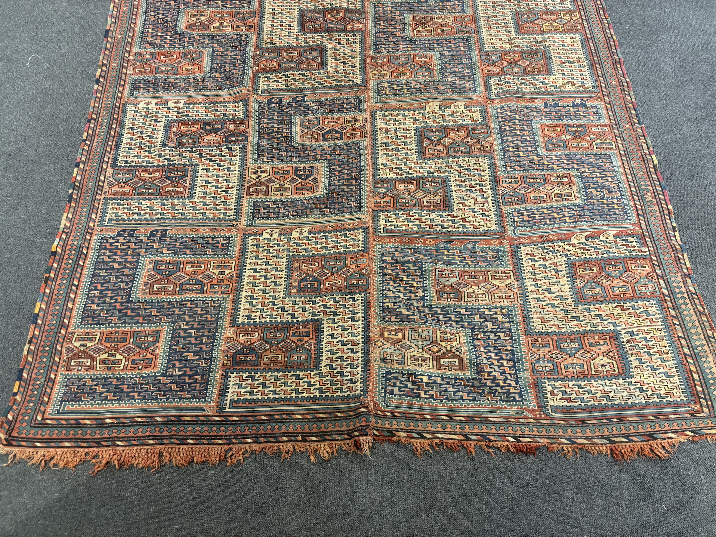 An antique Caucasian geometric rug, 255 x 210cm